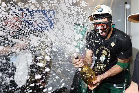 Jayson Tatum sprays champagne